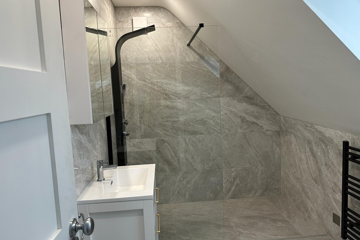 London bathroom refurbishment featuring designer fittings, underfloor heating, and modern tiling